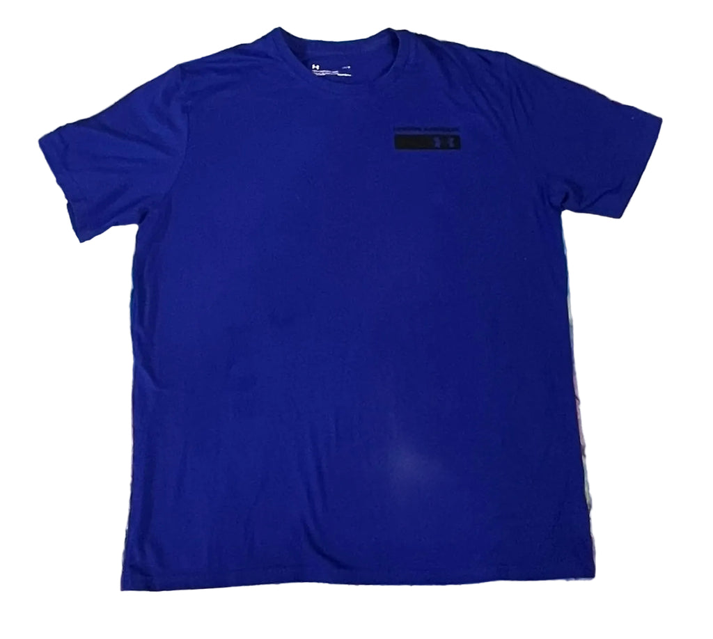 A royal blue short-sleeve crewneck t-shirt. A small black rectangular logo patch is visible on the left chest.