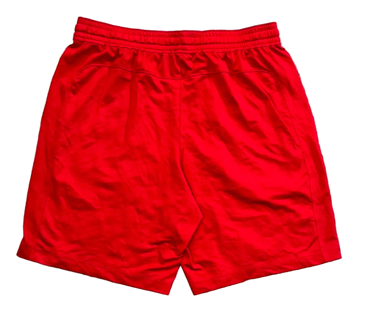 Red athletic shorts with an elastic waistband,