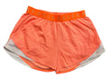 A pair of bright orange athletic shorts with a matching orange waistband featuring the Under Armour logo,