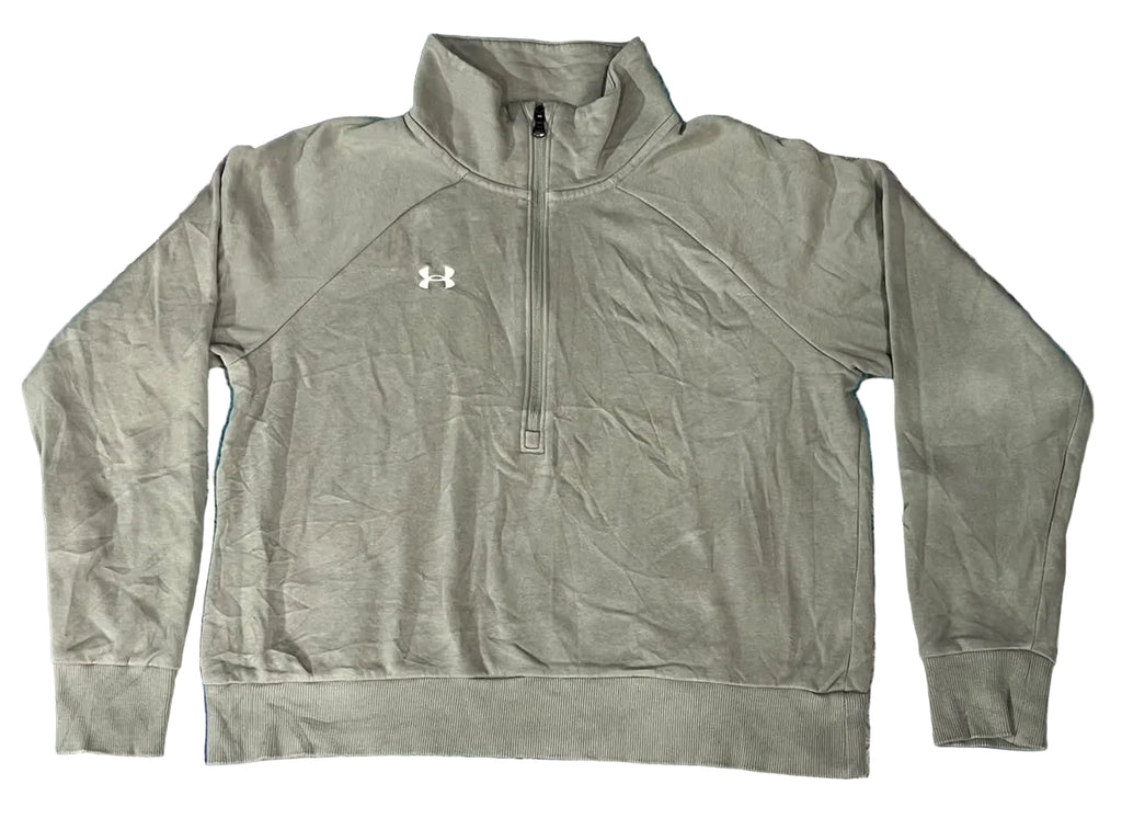 A gray Under Armour quarter-zip pullover sweatshirt  textured shag rug. The sweatshirt features a white Under Armour logo on the left chest.