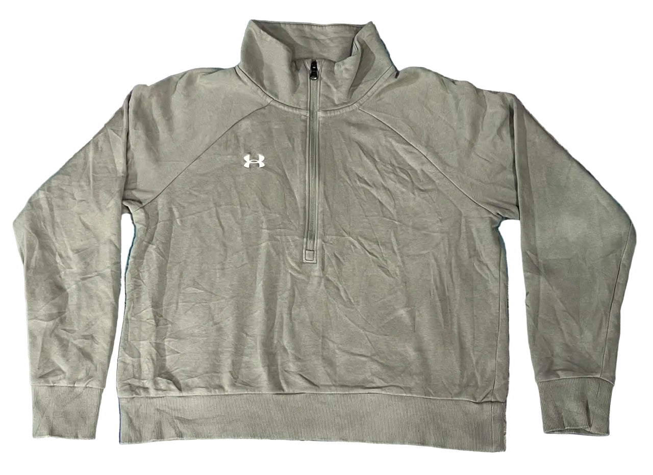 A gray Under Armour quarter-zip pullover sweatshirt  textured shag rug. The sweatshirt features a white Under Armour logo on the left chest.