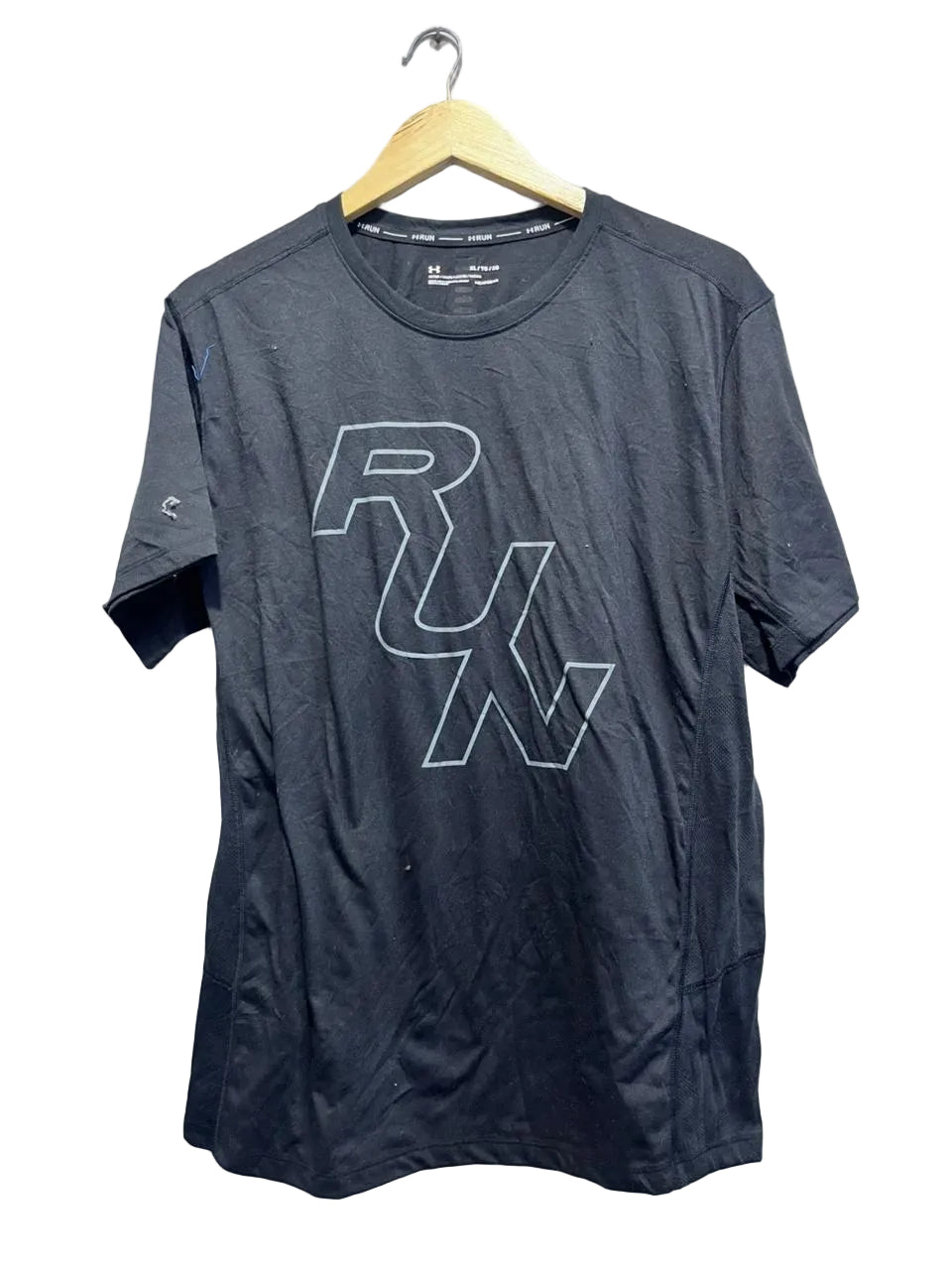 Black t-shirt with 'RUN' logo on a hanger against a white background