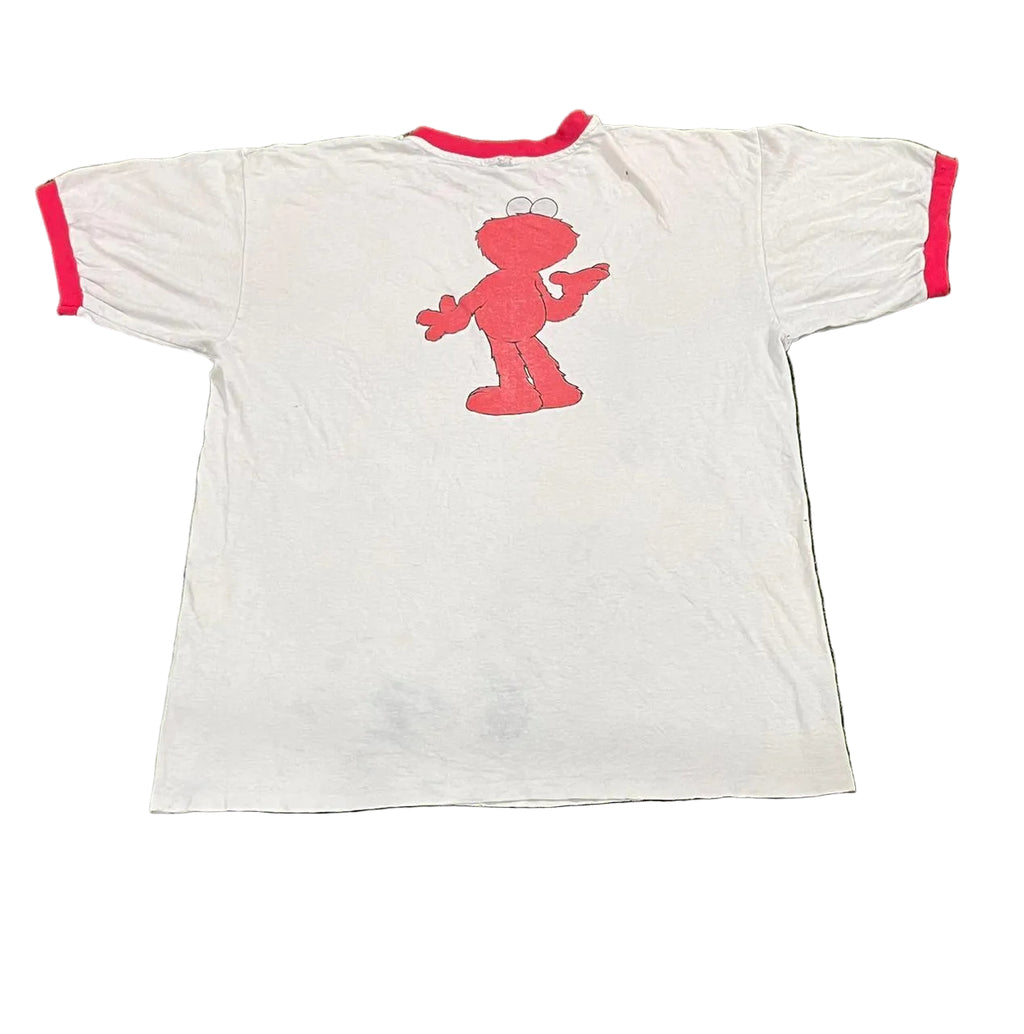White t-shirt with red character design on a white background
