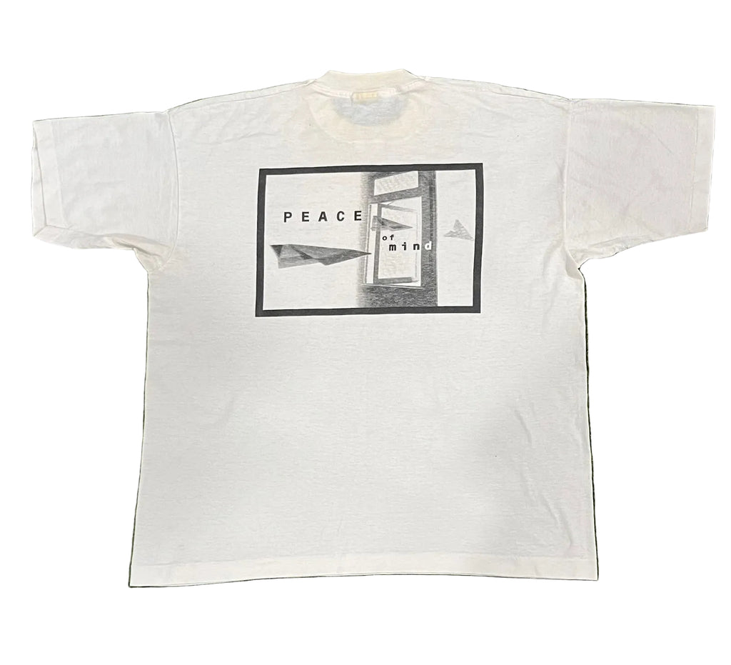 VINTAGE MEN PRINTED T-SHIRT ON A WHITE PLAIN BACKGROUND