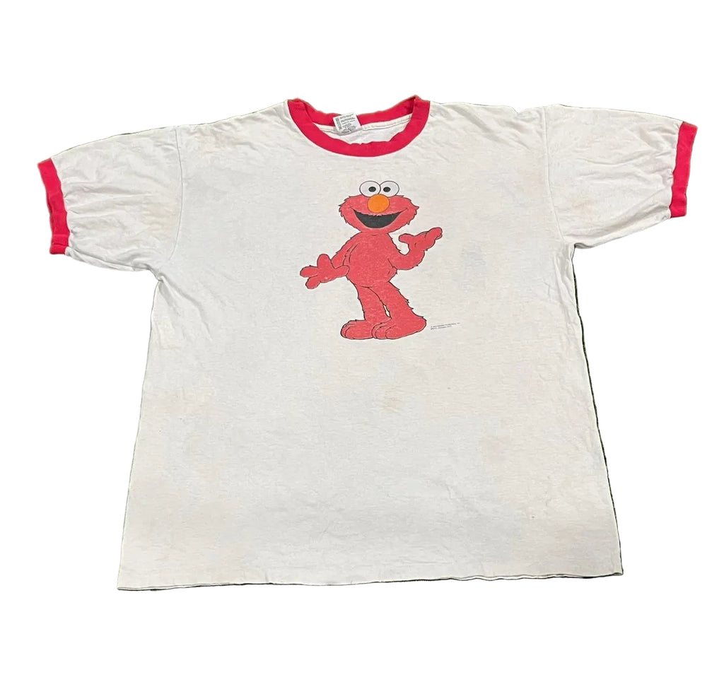 White t-shirt with red trim featuring a red character on a white background