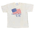 A white short-sleeve graphic t-shirt laid flat on white background The shirt features a printed waving American flag with the text 'Don't Mess With the U.