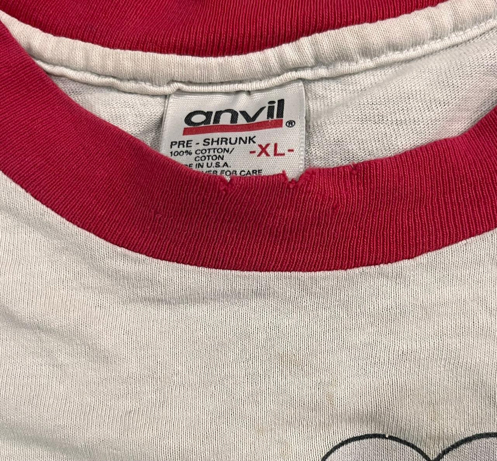 Close-up of a gray t-shirt with red trim and an Anvil label.