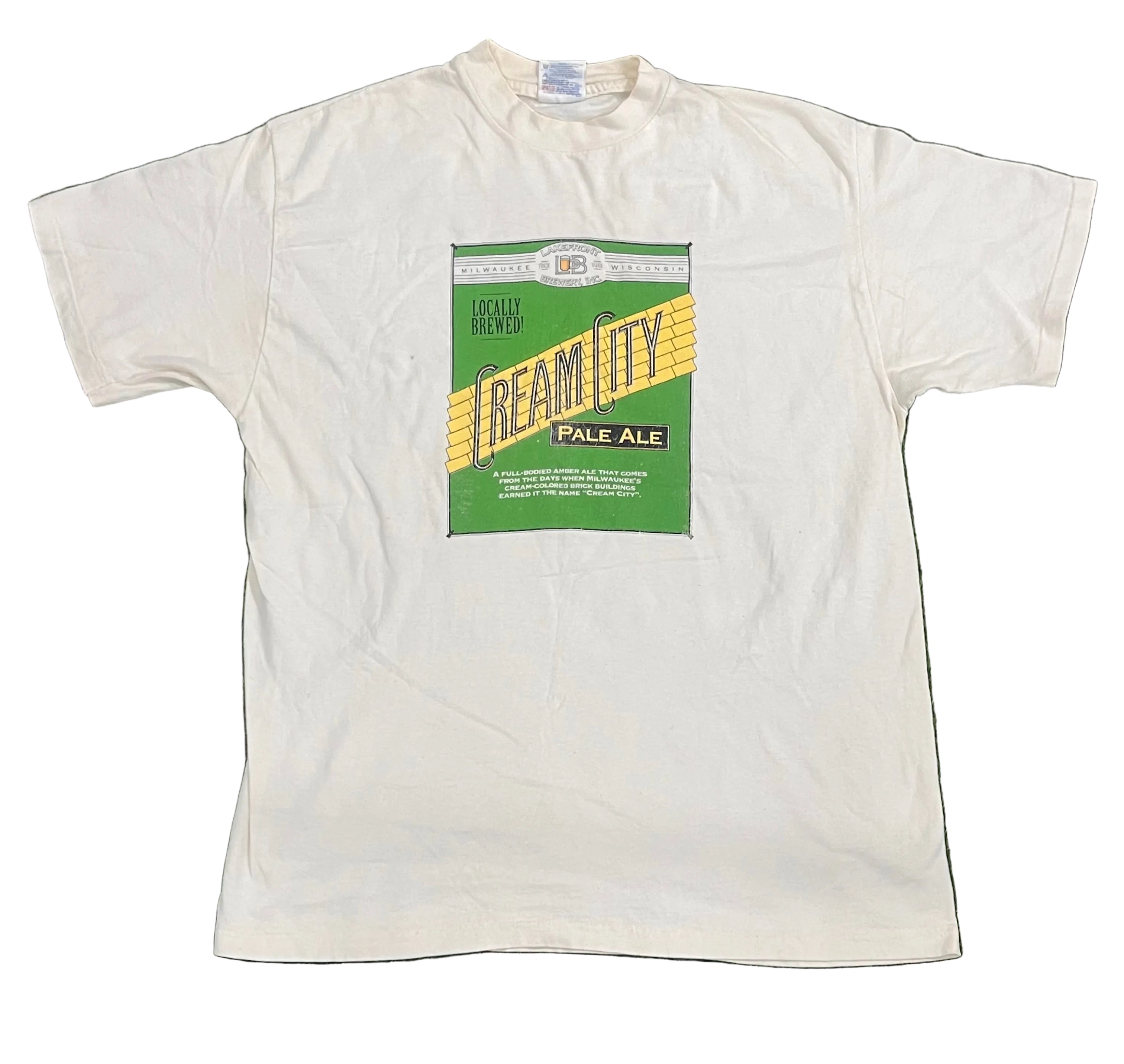 A white short-sleeve t-shirt featuring a vintage-style beer label graphic on the chest that reads 'Reamity Pale Ale' with green, yellow, and black colors.