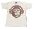A white short-sleeve graphic t-shirt featuring a large graphic print of a chimpanzee wearing brown headphones.