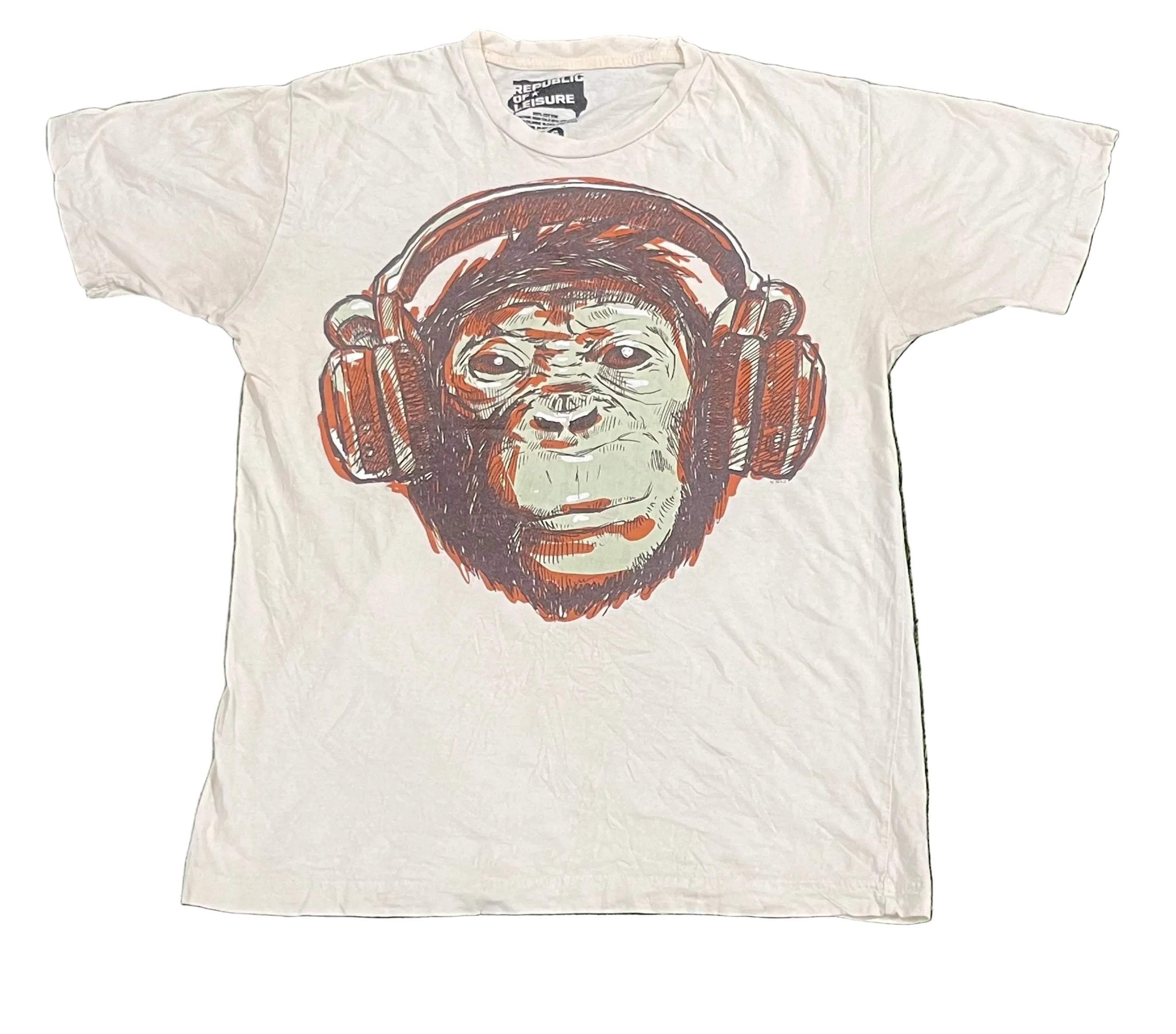 A white short-sleeve graphic t-shirt featuring a large graphic print of a chimpanzee wearing brown headphones.