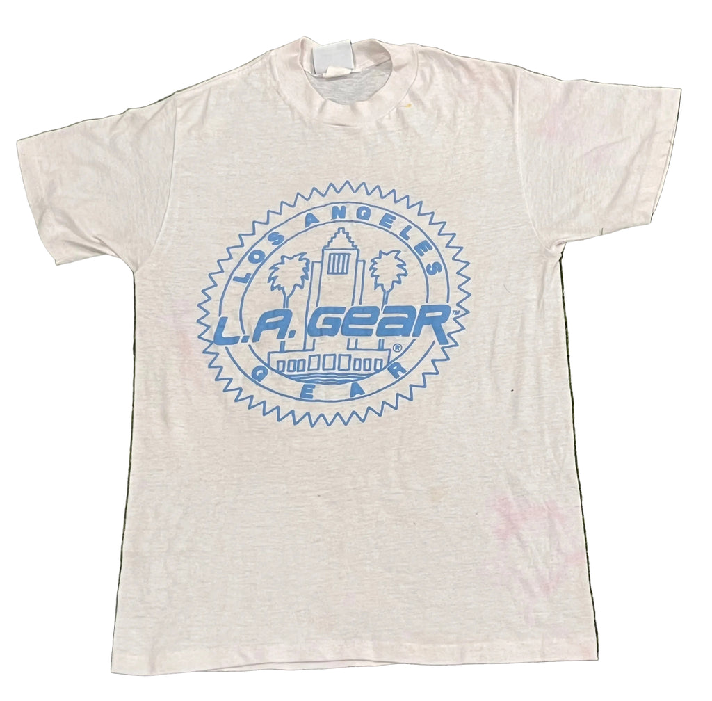 A white short-sleeve t-shirt with a blue circular 'Los Angeles L.A.