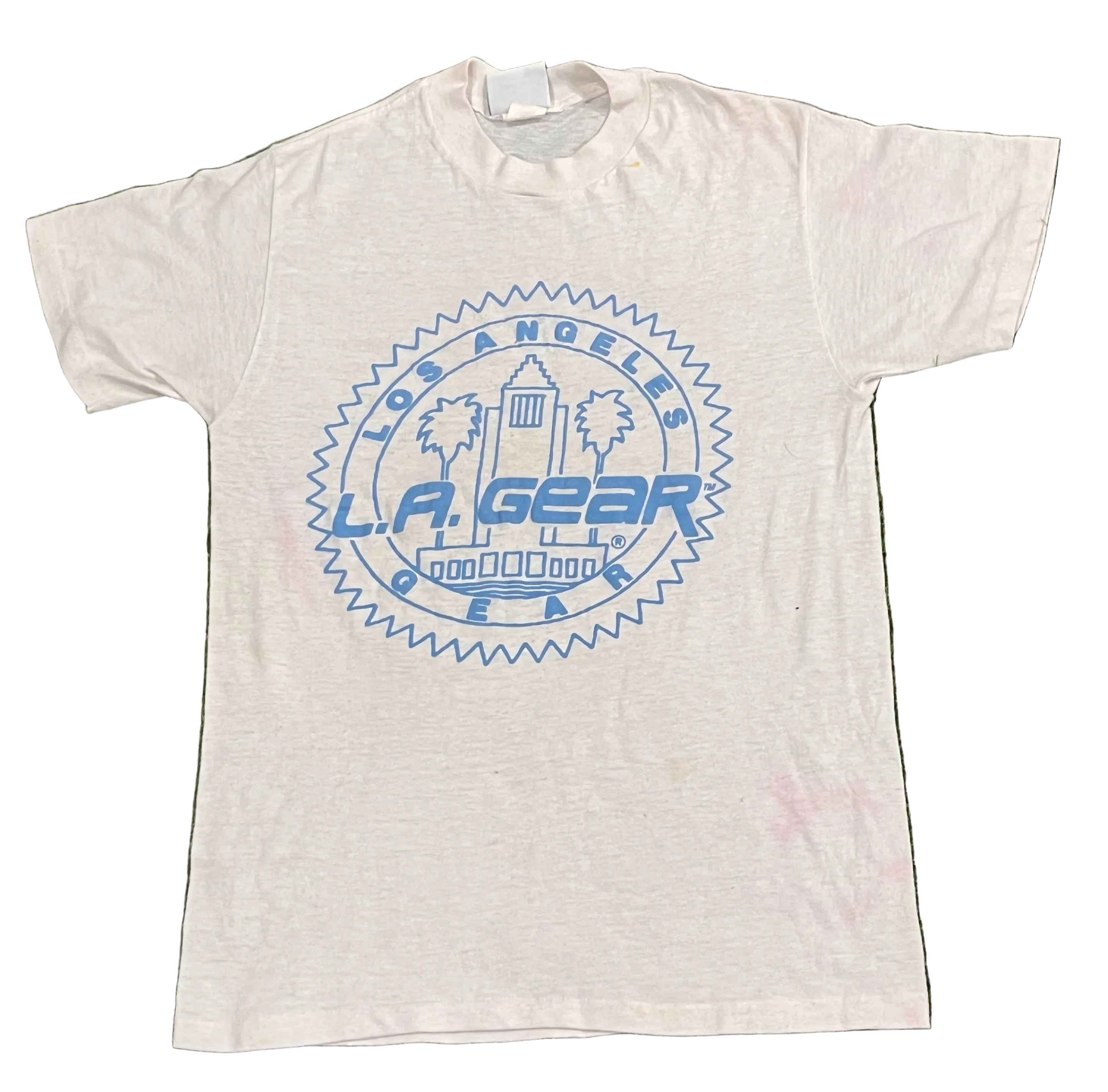 A white short-sleeve t-shirt with a blue circular 'Los Angeles L.A.