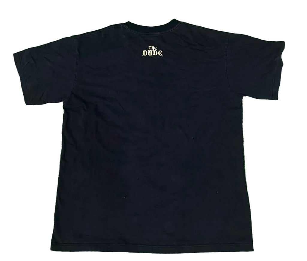 A black short-sleeve t-shirt with a small gold 'THE DUDR' logo printed on the upper back