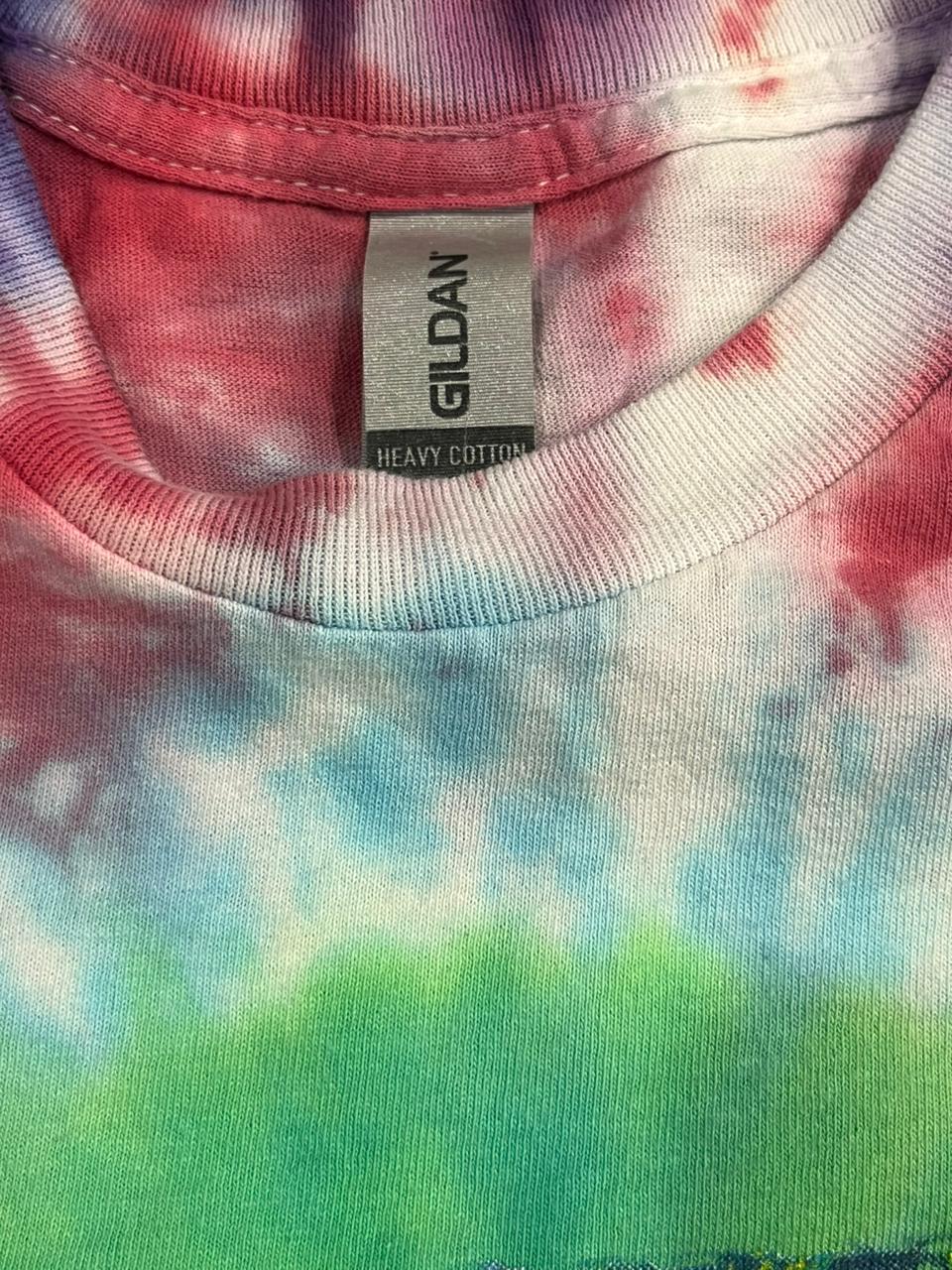Close-up of a tie-dye shirt with a Gildan label.