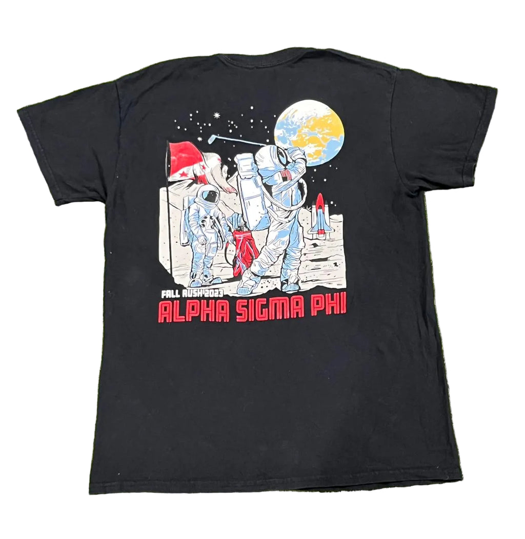 A black short-sleeve t-shirt l featuring a large back graphic of astronauts on the moon with a globe and the text 'ALL LEAGUES ARE ALPHA SIGMA PHI' in red.