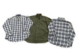 Three folded long-sleeve button-up shirts a white shirt with blue and black plaid on the left, an olive green shirt in the center, and a white shirt with blue and black plaid on the right.