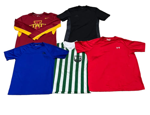 Five athletic t-shirts  a maroon long-sleeve Iowa State shirt with yellow sleeves and chest graphic, a black Adidas shirt, a royal blue Under Armour shirt, a green and white striped soccer jersey, and a red Under Armour shirt.