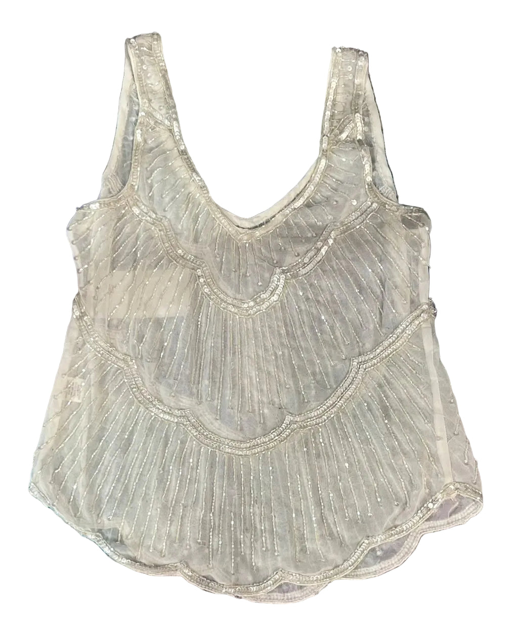 A sleeveless white mesh top with scalloped edges and bead embellishments,