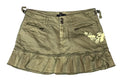 An olive green denim mini skirt with a ruffled hem, front button closure, zippered pockets, and a yellow embroidered butterfly design on the left side,
