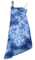 A blue tie-dye slip dress with a floral cherry blossom pattern,