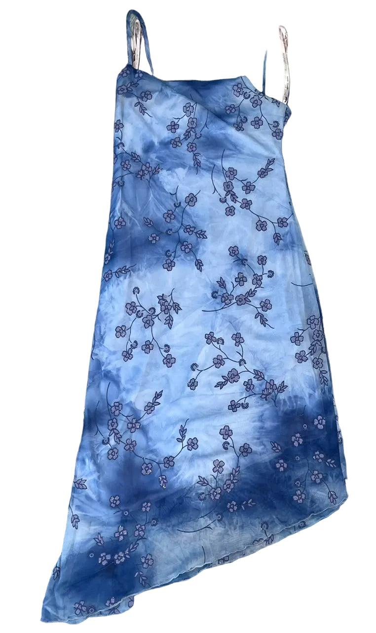 A blue tie-dye slip dress with a floral cherry blossom pattern,